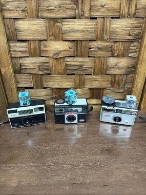 Vintage Film Cameras Trio - Black, White, Cream with Blue Flash Cubes